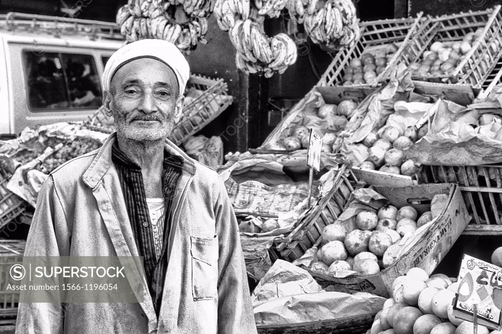 Vendor men selling fruits and vegetables in market in Cairo Egypt
