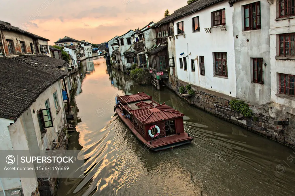 Boat travels along Shantang canal in Suzhou, China