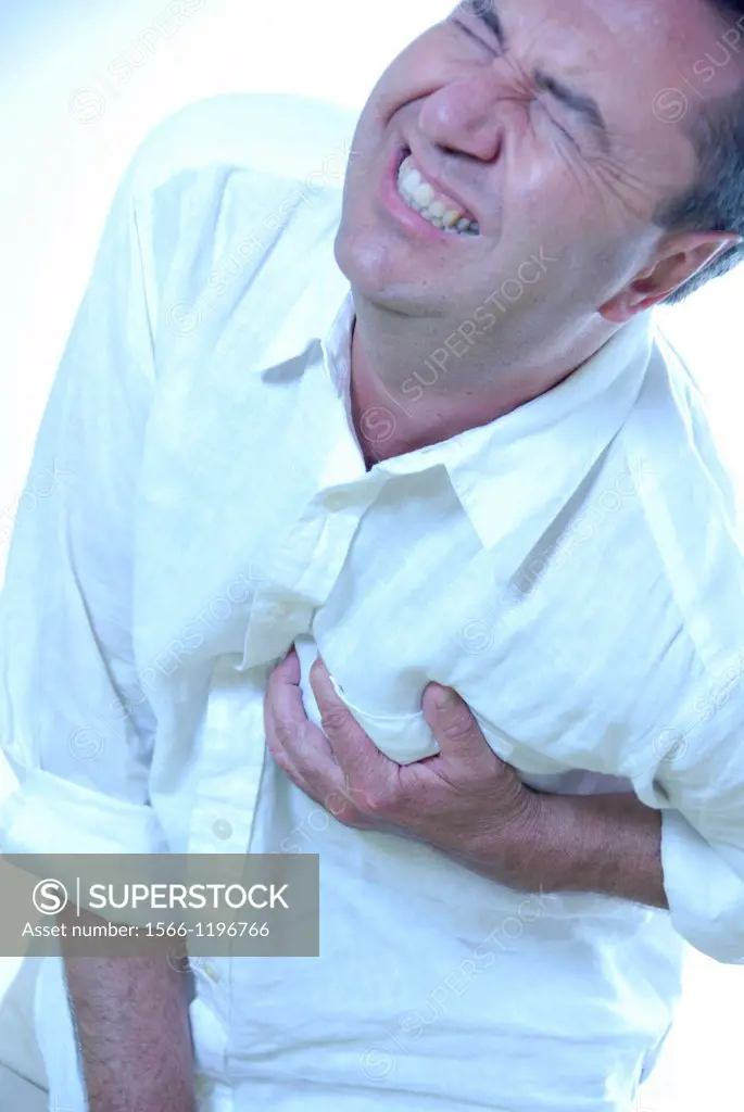 Man experiencing pain in his chest  This may be due to angina or a heart attack