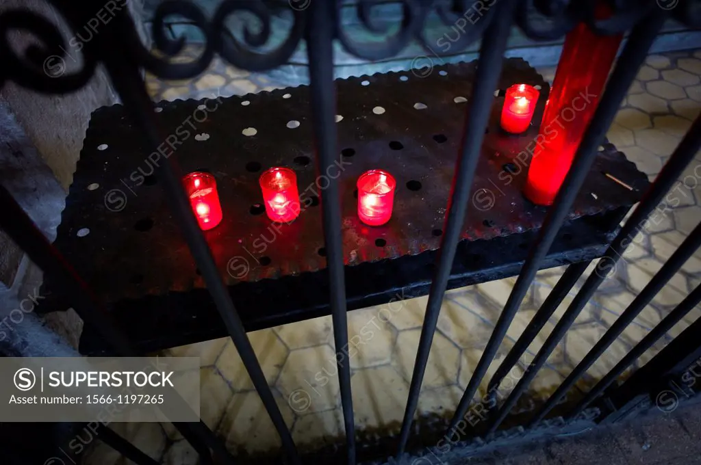 pregarias with candles in a church, religios environment
