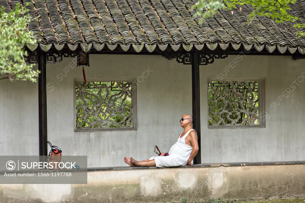 A Chinese man rests in the Humble Administrator´s garden in Suzhou, China