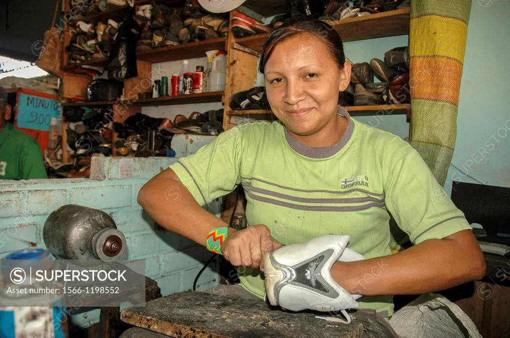 Woman repairing shoes, Colombia, South America