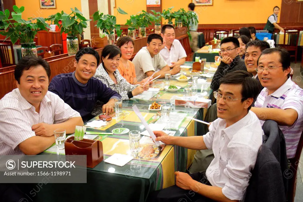China, Shanghai, Huangpu District, Sichuan Road, restaurant, Asian, man, woman, table, banquet, smiling, dining,