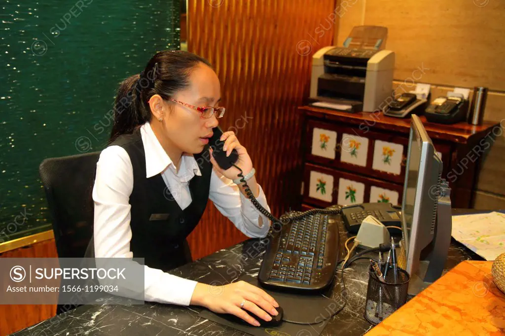 China, Shanghai, Dianchi Road, Huangpu District, Manhattan Bund Business Hotel, lobby, Asian, woman, employee, front desk, clerk, telephone, computer,...