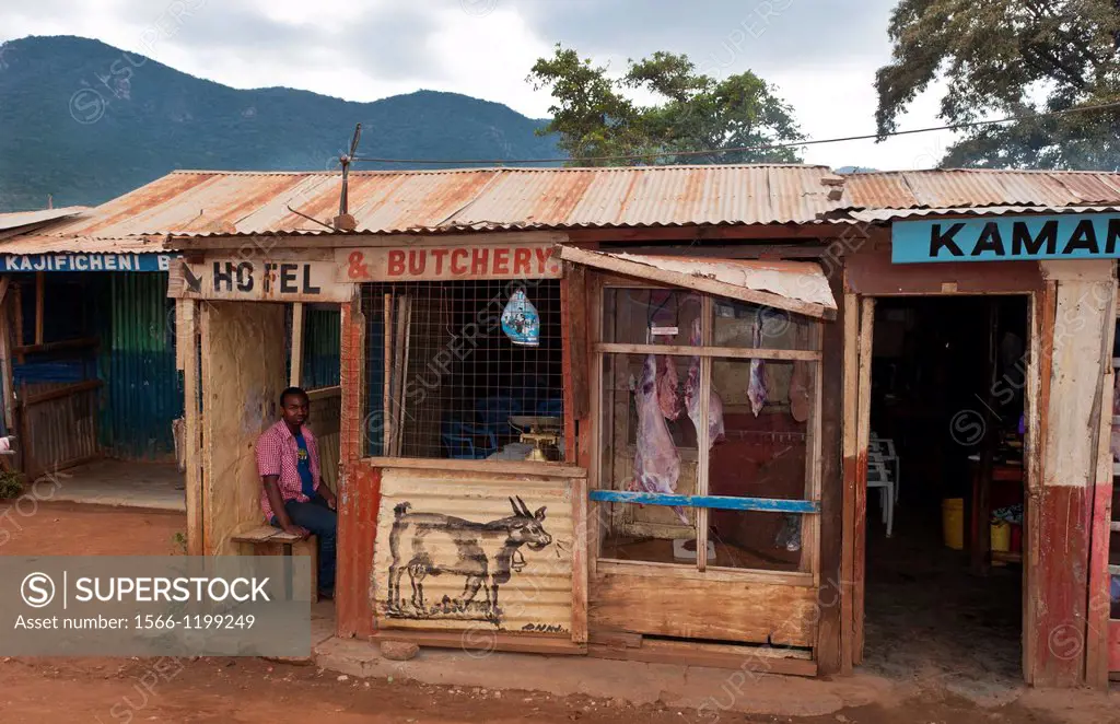 Kenya Africa Namanga border town stores and shops of cheap hotel and butchery with local people in poor village