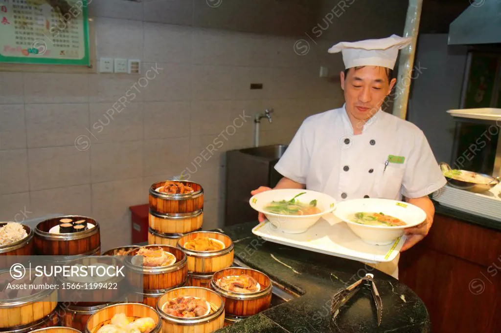 China, Shanghai, Huangpu District, Sichuan Road, restaurant, Asian, man, cook, kitchen help, chef, tray, serving, soup,