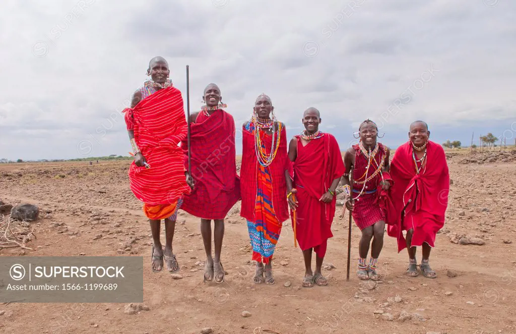 Kenya Africa Amboseli Masai men in red costume dress and beads in Amboseli National Park safari 1