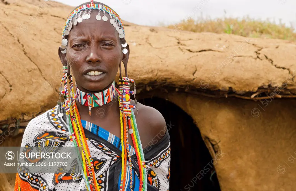 Amboseli National Park Kenya Africa safari Masai woman welcome to village Amboseli Maasai, hut, mud, home, beads, red, color, 1