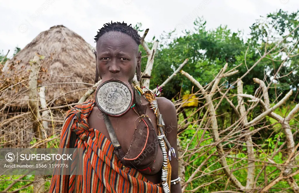 Mago National Park Ethiopia Africa Mursi tribe women Lower Omo Valley with clay pots in lips tradition tribal wild pottery 15