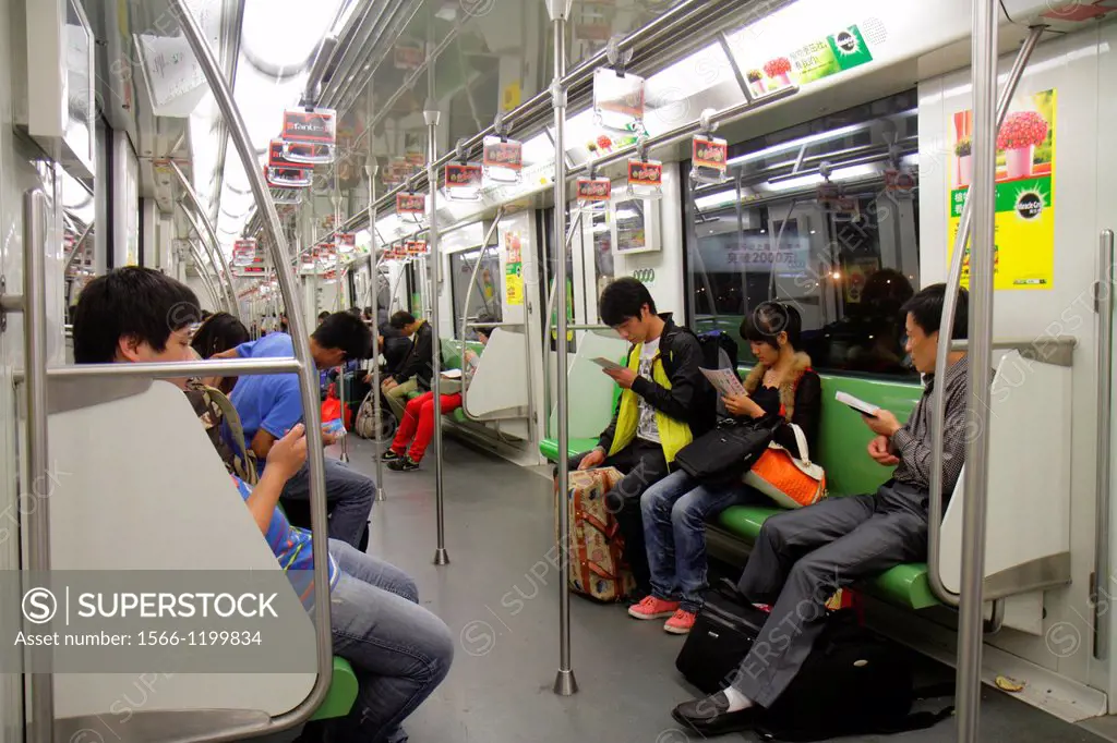 China, Shanghai, Metro, subway, public transportation, riders, Asian, man, woman, Green Line 2,