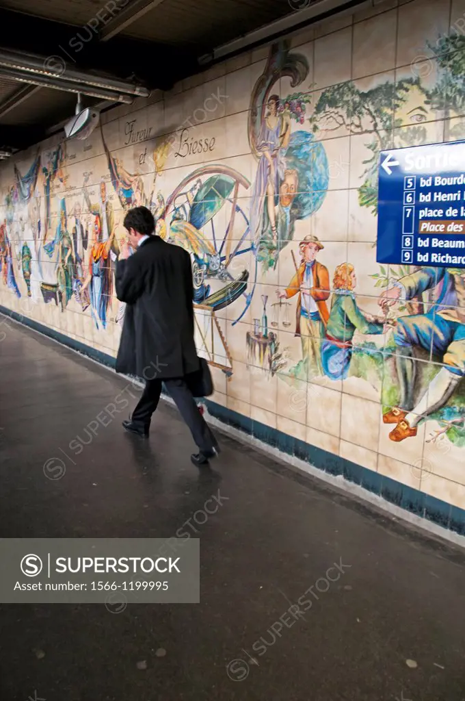 young businessman walking, Bastille subway station, Paris, France