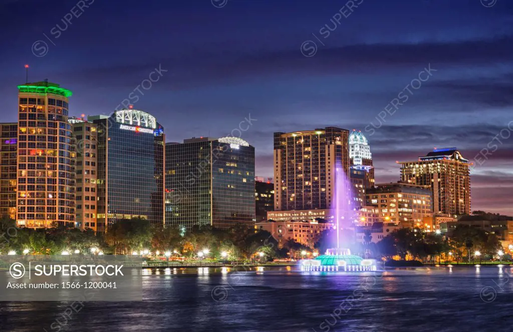 Colorful scenic of beautiful Lake Eola and fountain with skyline at twilight in downtown center of Orlando Florida