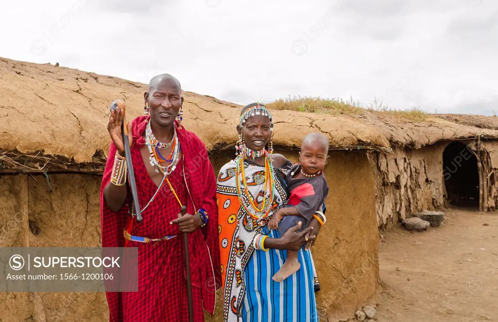 Amboseli National Park Kenya Africa safari Masai couple with child welcome to village Amboseli Maasai, hut, mud, home, beads, red, color, 1