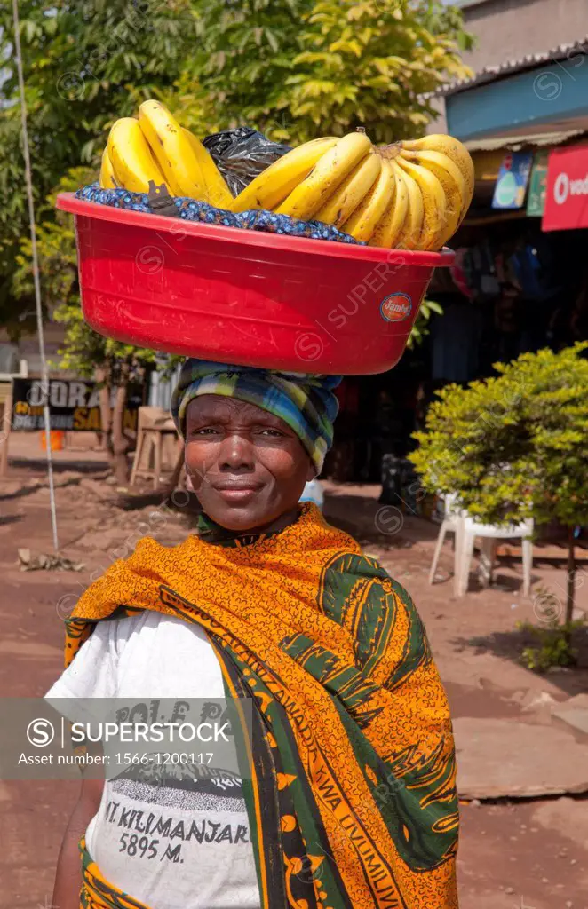 Tanzania Africa Mosquito Village Mto Wa Mbu town poor village with woman with bananas for sale and stores for locals 4