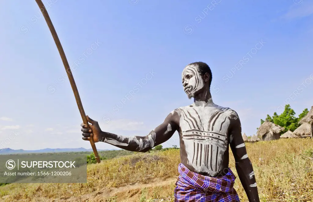 Korcho Ethiopia Africa village Lower Omo Valley Karo tribe young warrior with white painted face 25