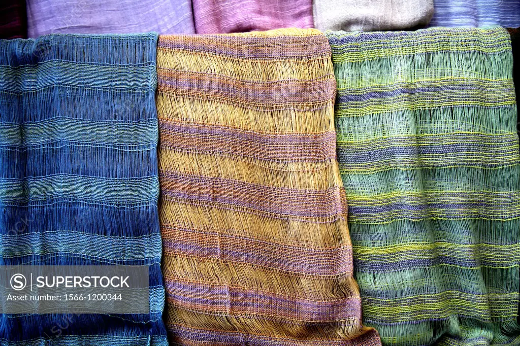 Hand-Woven Scarves Hangin on a Retail Display
