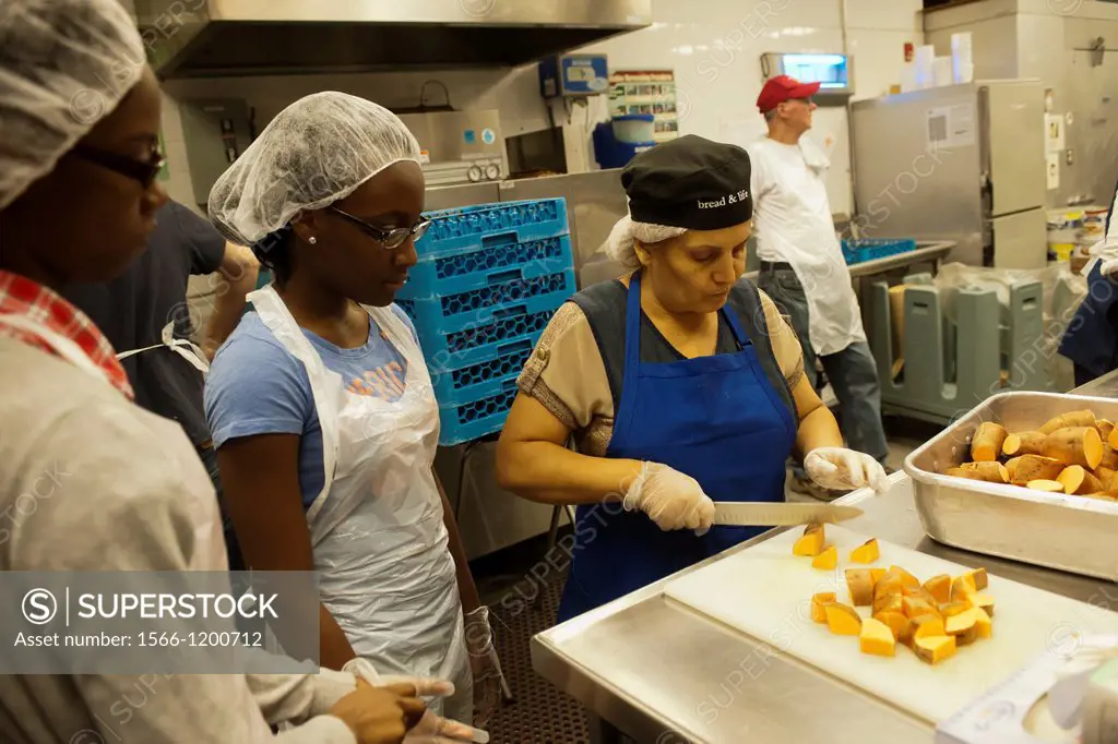 Volunteers and staff of St John´s Bread and Life, prepare and serve a Thanksgiving dinner for the neediest at their facilities in the Bedford-Stuyvesa...