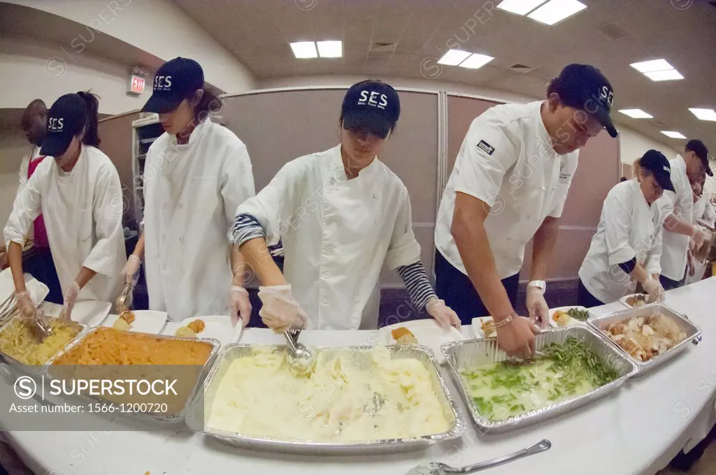 Volunteers for the Salvation Army serve Thanksgiving Dinner to the neediest at the N Y Temple in New York The Salvation Army expects to feed several t...