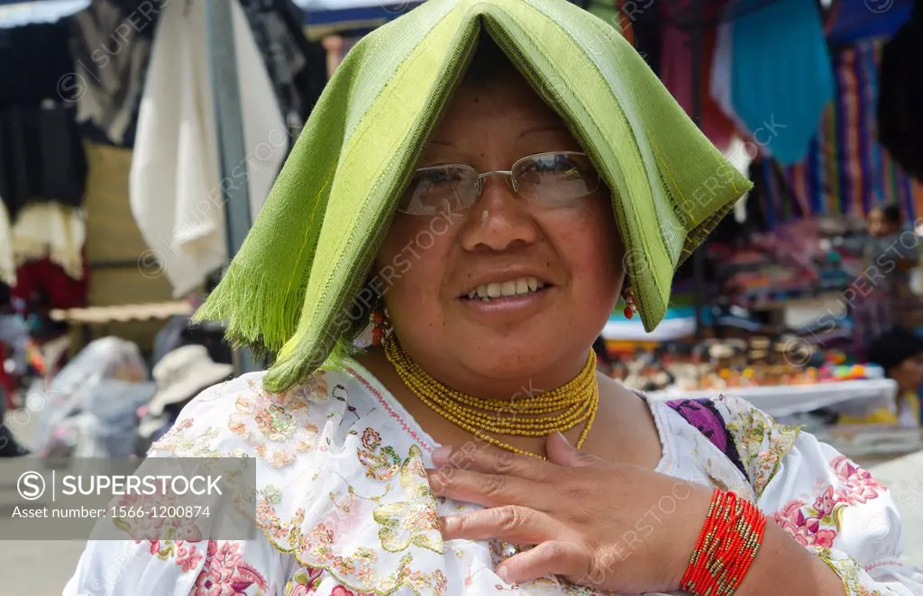 Woman portrait in traditional dress in small village of Otavalo Ecuador South America