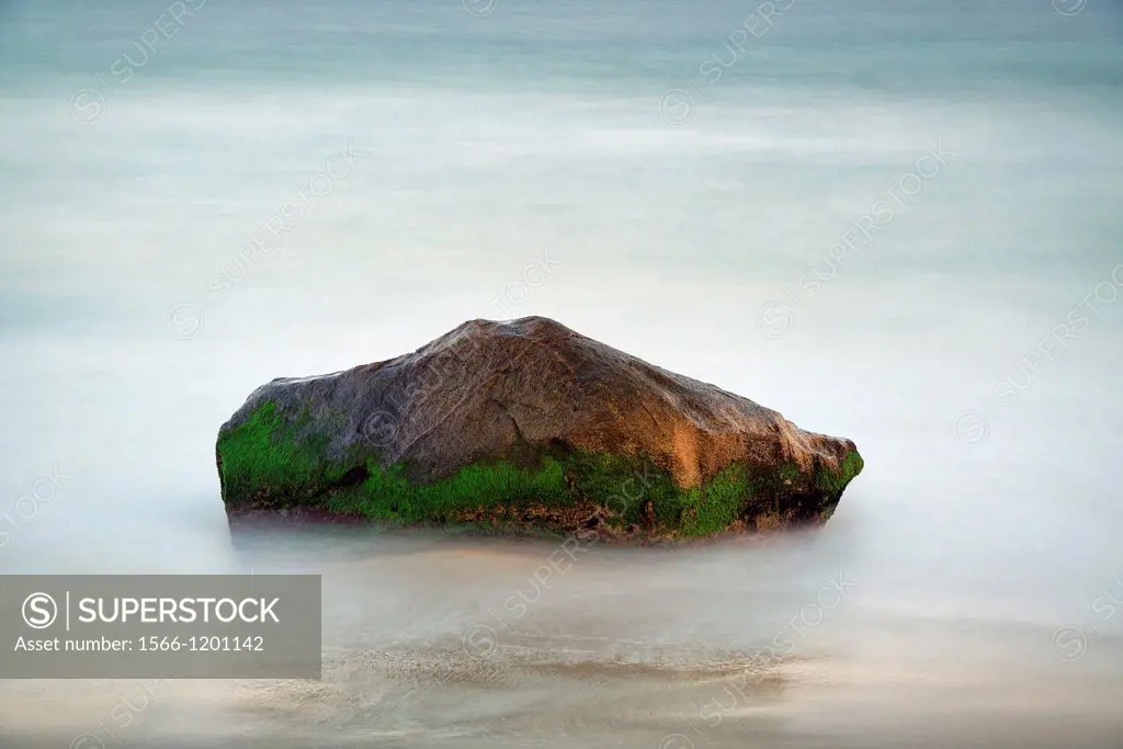 Rock with moving ocean water