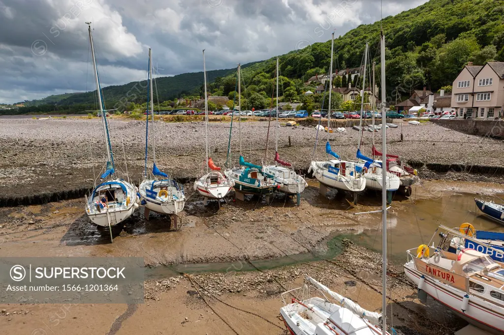 Small boats in Porlock Weir Harbour at low tide, Exmoor National Park, North Devon, England, UK, Europe