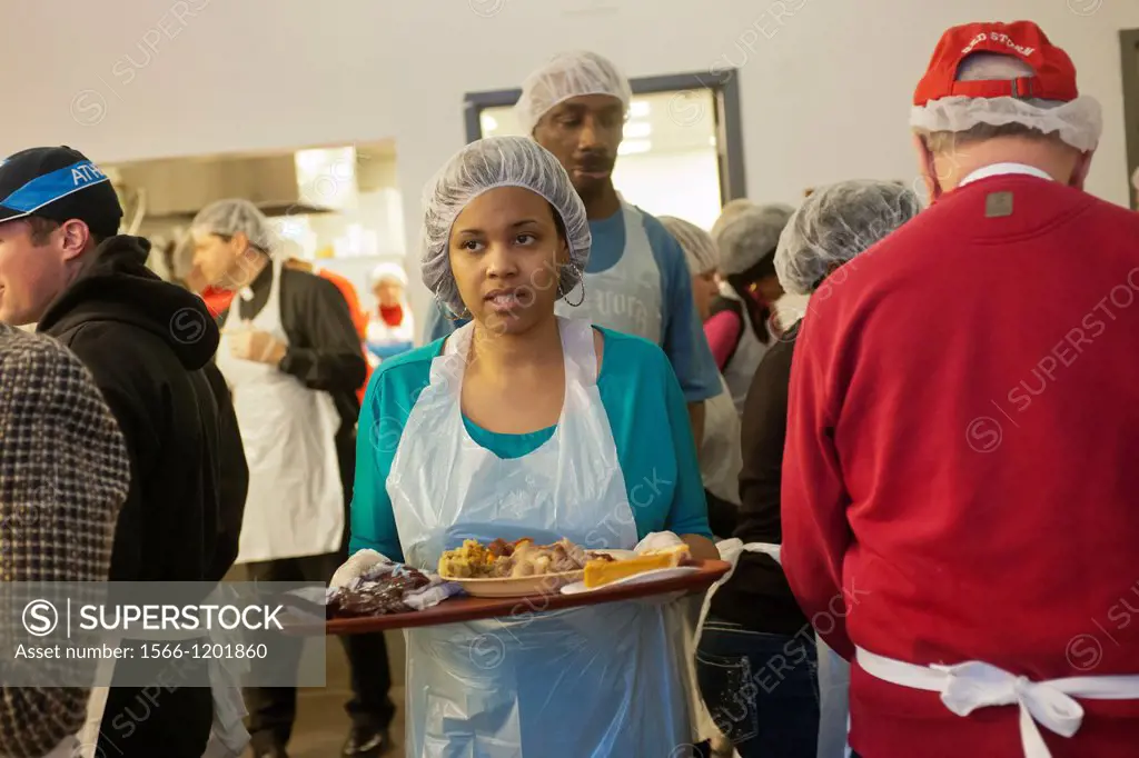 Volunteers and staff of St John´s Bread and Life, prepare and serve a Thanksgiving dinner for the neediest at their facilities in the Bedford-Stuyvesa...