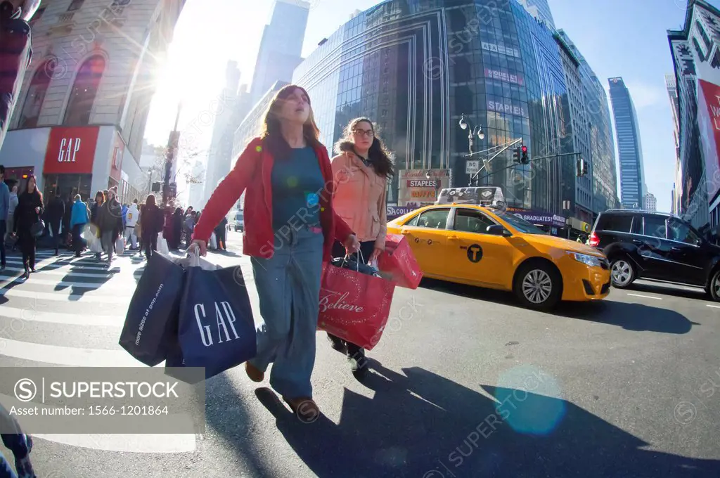 Shoppers in the Herald Square shopping district in New York looking for bargains on Black Friday, the day after Thanksgiving Many retailers opened the...