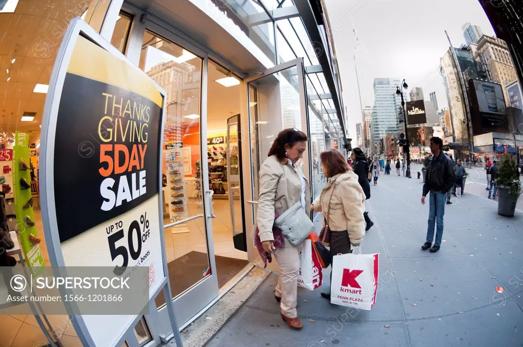 Shoppers at the Payless shoe store in the Herald Square shopping district in New York on Thanksgiving Day Many retailers are opening their doors on Th...