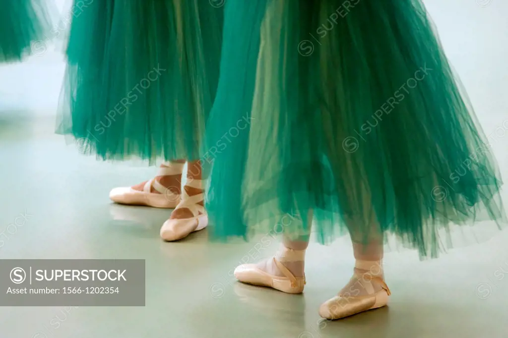 Performing ballerinas in green tutus