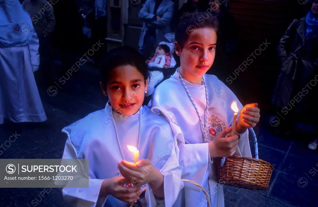 Penitents  Resurrection Sunday  In calle Mesones  Brotherhood`Resucitado de Regina´  Granada  Andalusia, Spain