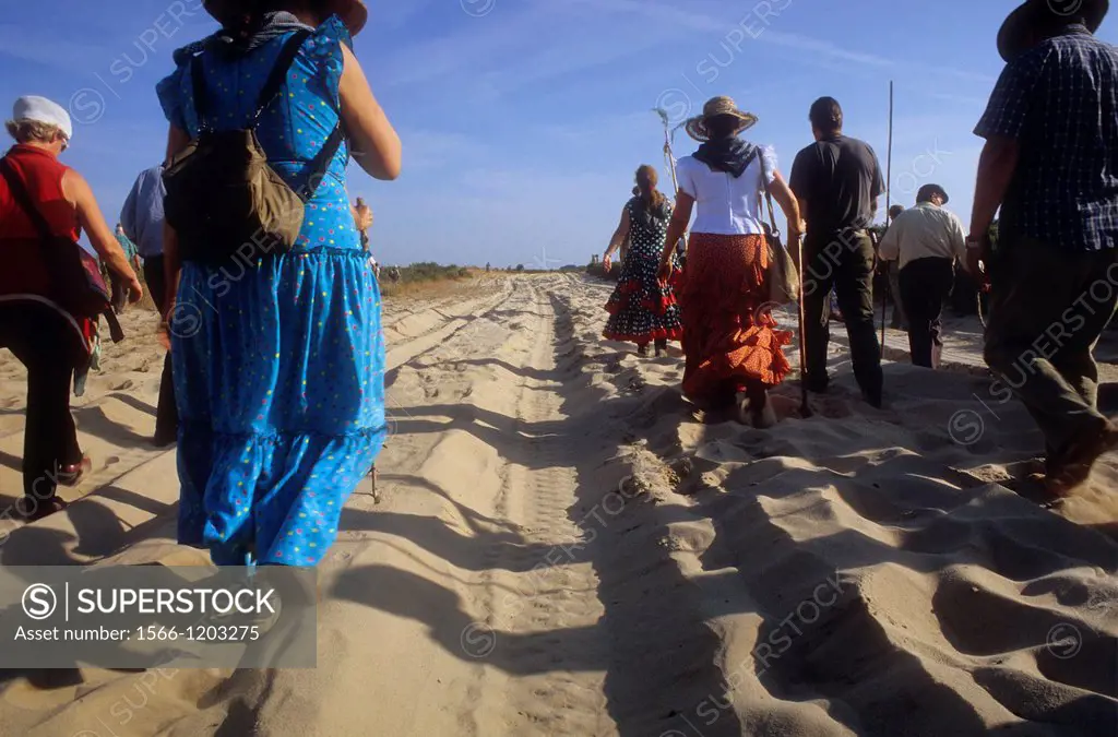 Pilgrims walking near Doñana Palace,Romeria del Rocio, pilgrims on their way through the Doñana National Park, pilgrimage of Sanlúcar de Barrameda bro...
