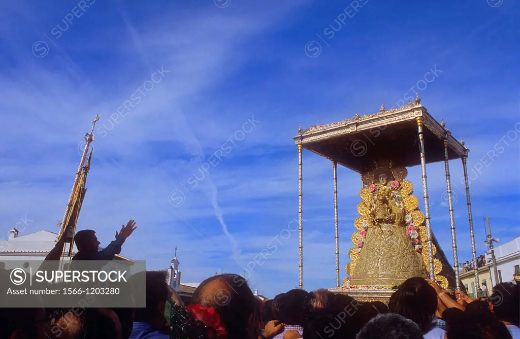 priest screaming wishes and thanks to the virgin,Romería, pilgrimage, at El Rocío, Blanca Paloma, virgin procession, Almonte, Huelva province, Spain
