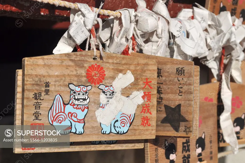 Naha, Okinawa, Japan, Ema, traditional votive wooden boards with a wish written on and the symbol of the shrine, at the temple of Conan the praying d...