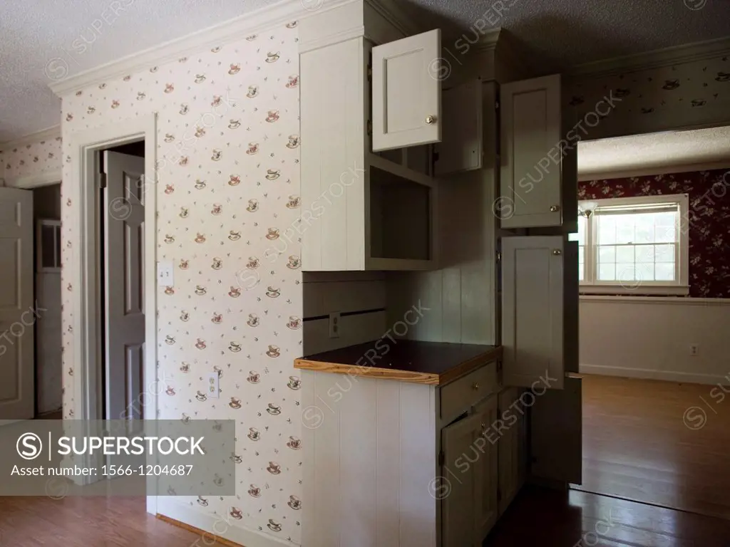 Empty cabinets inside the kitchen of a foreclosed home in Burlington, North Carolina, United States
