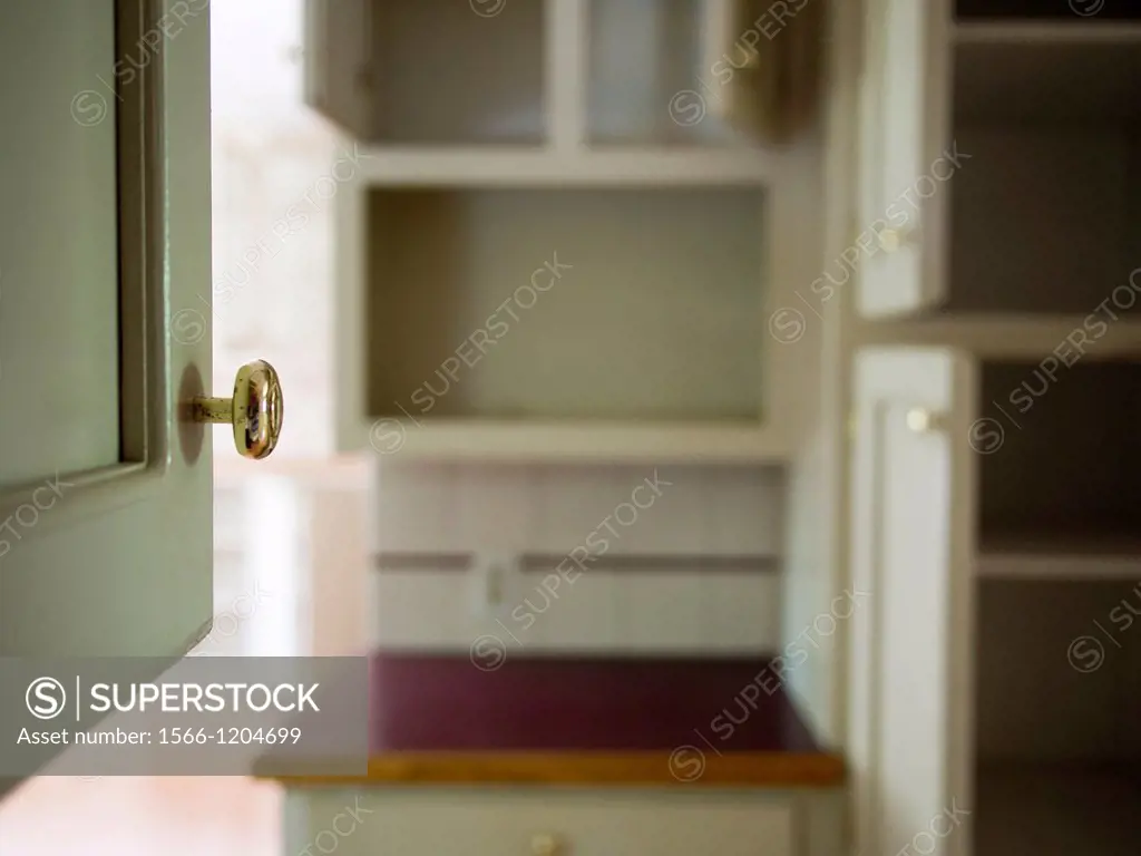 Cabinet door handle inside a foreclosed home in Burlington, North Carolina, United States