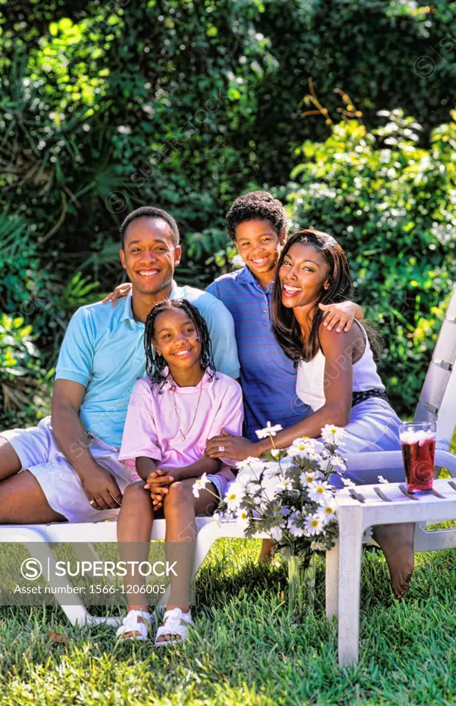 Black african american family outside at home relaxing with caring and love lifestyle