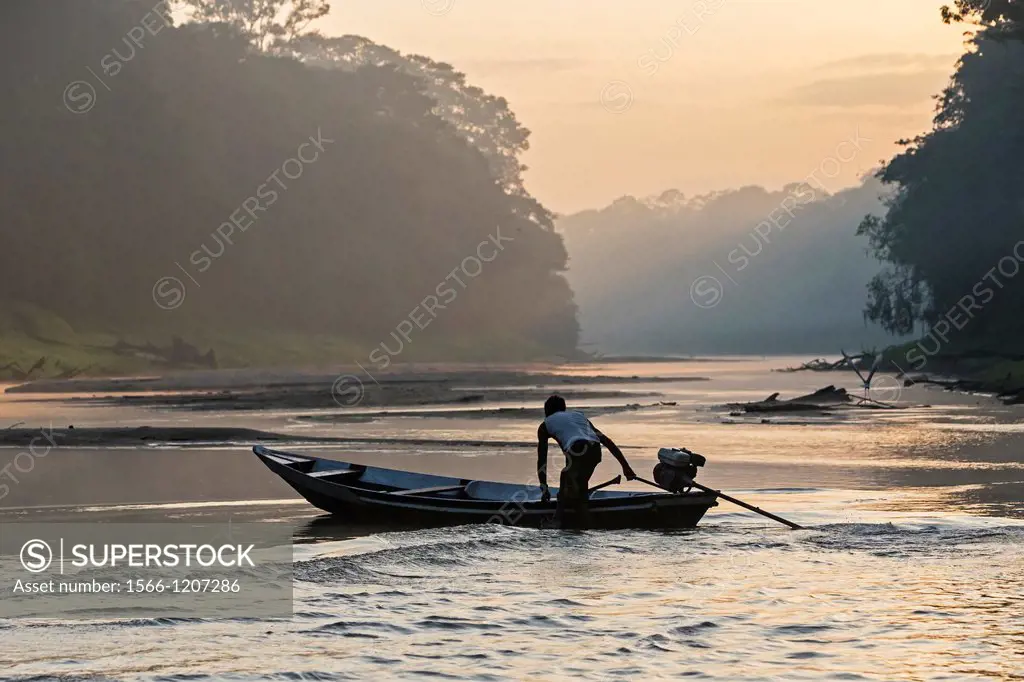 South America ,Brazil, Amazonas state, Manaus, Amazon river basin, rowboat sailing on a tributary creek of the Rio Negro , sunrise