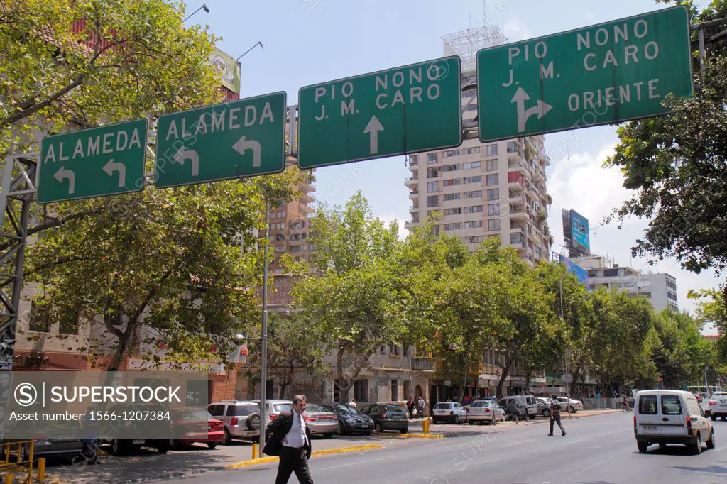 Chile, Santiago, Providencia, Avenida Vicuna Mackenna, street scene, traffic sign, direction, information, neighborhood, parked cars, Hispanic, man, c...
