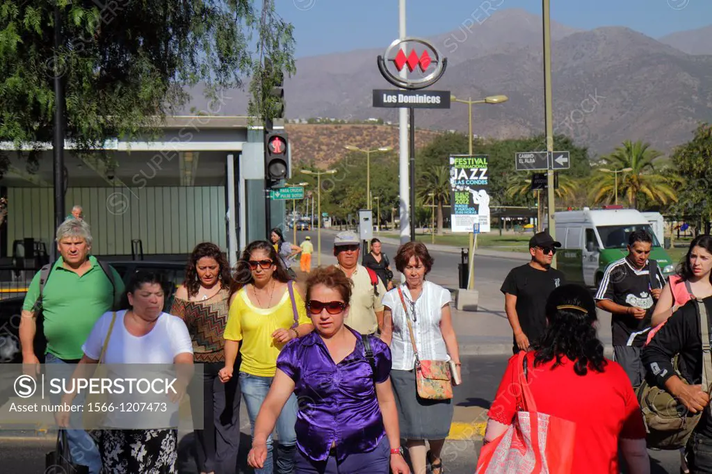 Chile, Santiago, Las Condes, Avenida Apoquindo, Los Domincos Metro Station, street scene, crossing, intersection, traffic light, Hispanic, woman, man,...
