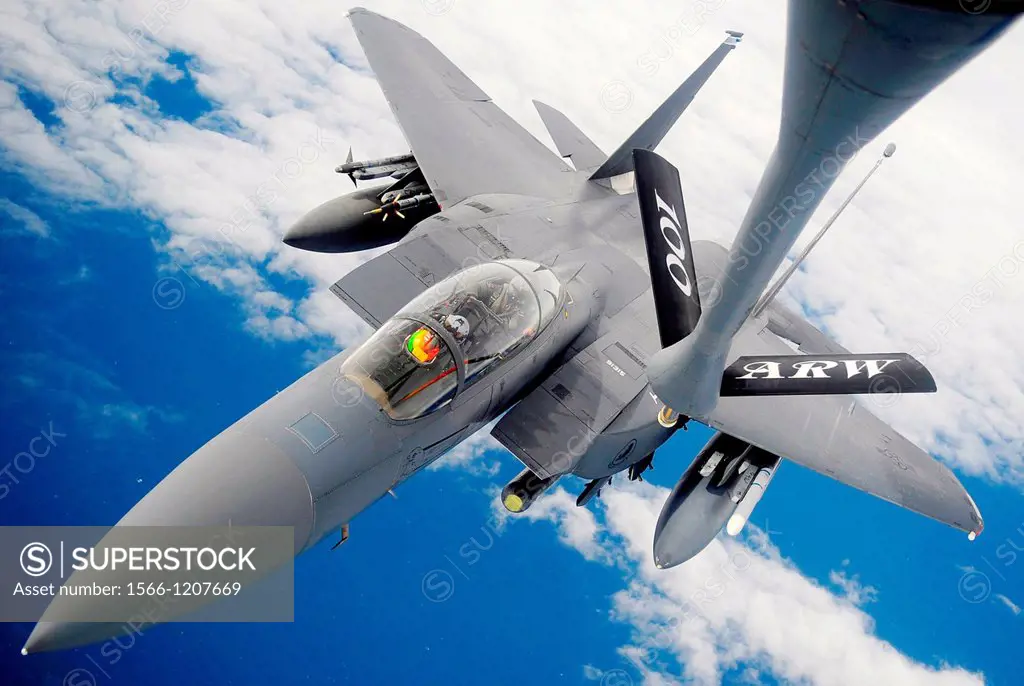 An F-15E Strike Eagle receives fuel from a 100th Air Refueling Wing KC-135 Stratotanker during an aerial refueling mission Sept  10, 2012, over the At...