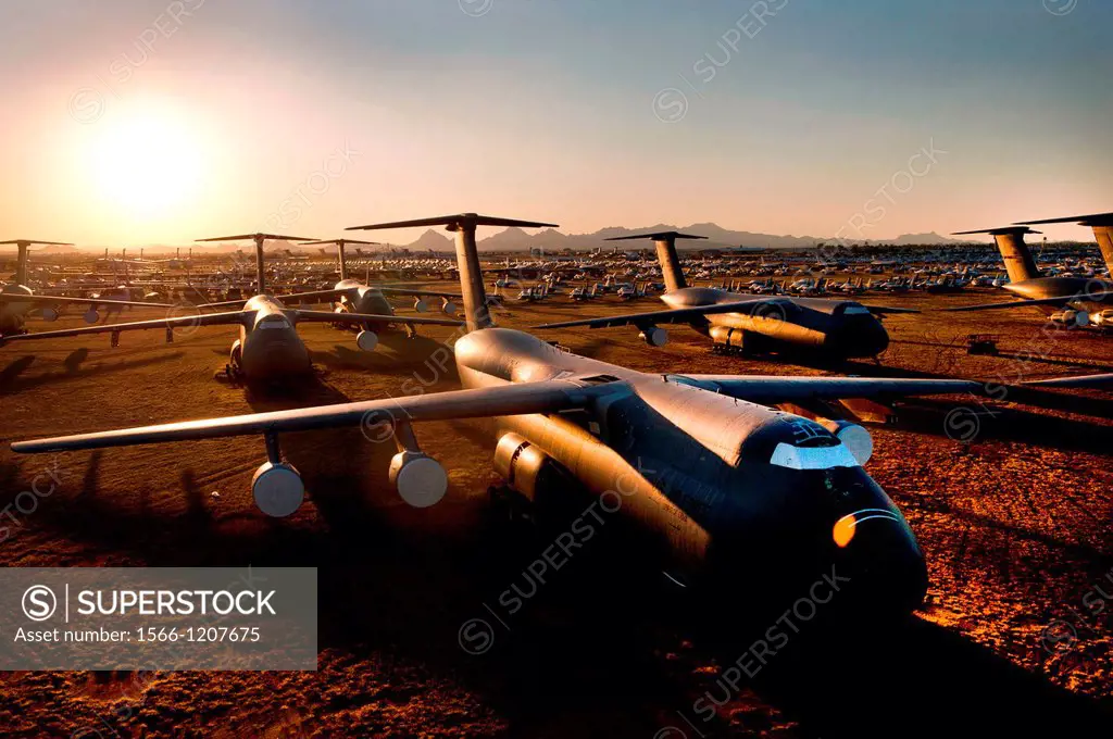 C-5 Galaxy and other aircraft sit at sunset at the 309th Aerospace Maintenance and Regeneration Group, often called the Boneyard, at Davis-Monthan Air...