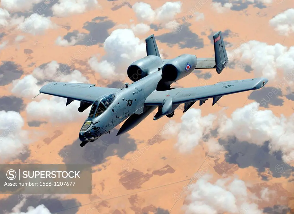 An A-10 Thunderbolt II flies off the wing of a KC-135 Stratotanker during a coronet mission over Egypt Oct  12, 2012  The A-10 is from the Arkansas Ai...