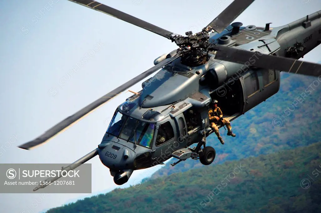 Members of the 33rd Rescue Squadron fly an HH-60G Pave Hawk at Osan Air Base, South Korea, Oct  20, 2012  The rescue squadrons participated in an air ...