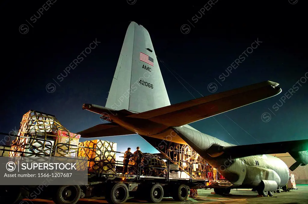 Airmen with the 774th Expeditionary Airlift Squadron load pallets on a C-130H Hercules at Bagram Airfield, Afghanistan, Nov  3, 2012  The 774th EAS pr...