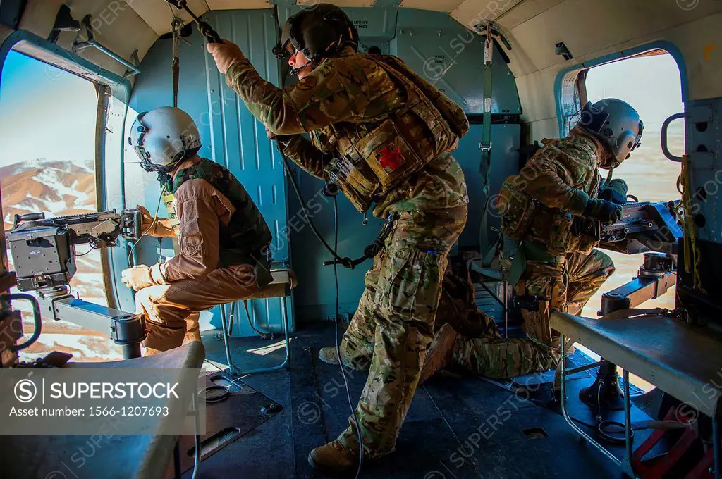 Tech  Sgt  Will Stimpson, center, and Staff Sgt  Michael Dinicola, right, evaluate Afghan air force Sgt  Razeg, as he provides over watch during a mis...