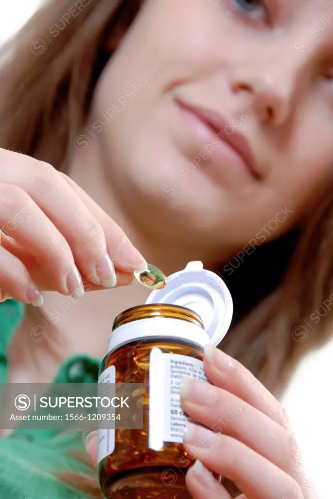 Young woman with omega 3 vitamine