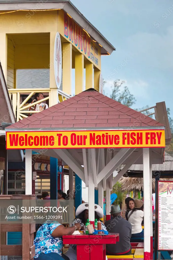 Bahamas, New Providence Island, Nassau, Arawak Cay, fish fry restaurants, signs, dusk