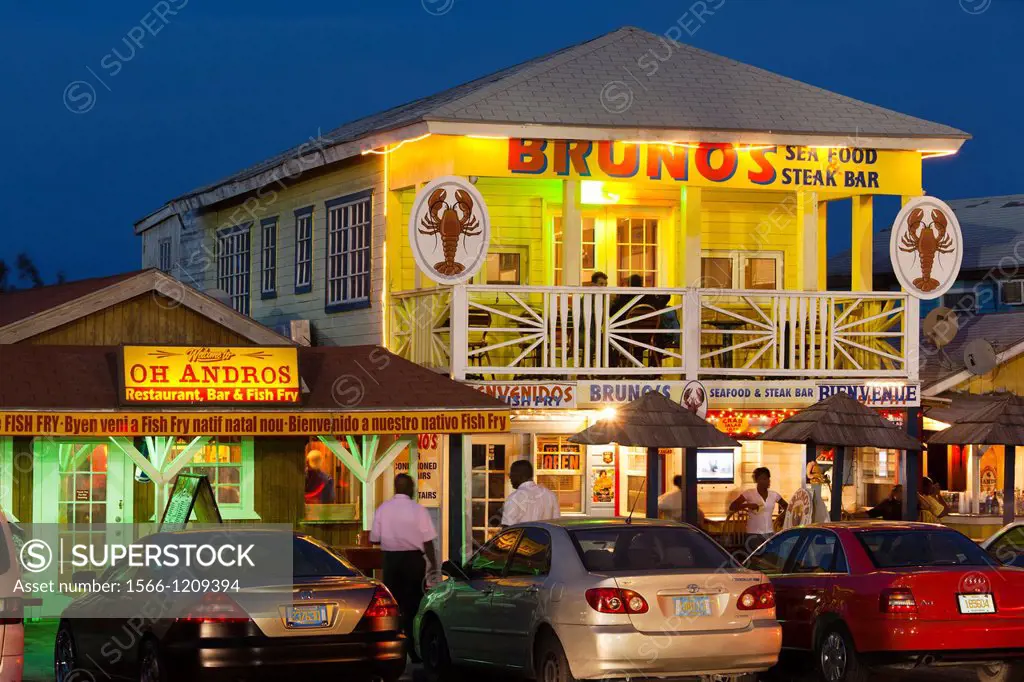 Bahamas, New Providence Island, Nassau, Arawak Cay, fish fry restaurants, signs, dusk