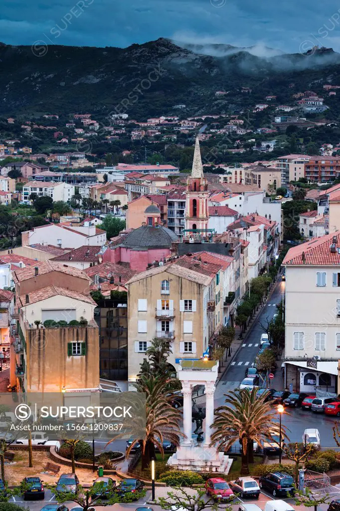 France, Corsica, Haute-Corse Department, La Balagne Region, Calvi, elevated city view above the Place Christophe Colomb, dusk