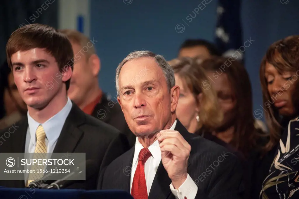 In the wake of the horrific massacre of elementary grade students in Newtown, CT New York Mayor Mike Bloomberg stands with survivors and relatives of ...